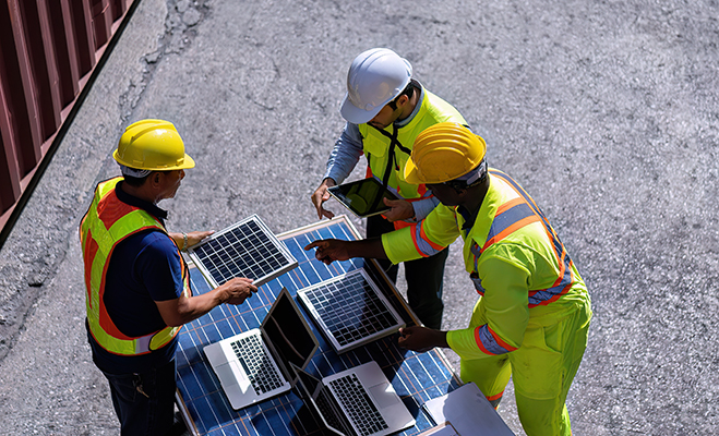 3 engineer working in clean solar energy industry talking about 3 engineer working in clean solar energy industry talking about